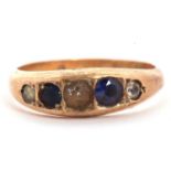 A 9ct sapphire and white stone ring, the alternating graduated sapphire and white stones in