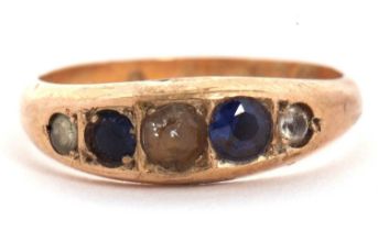 A 9ct sapphire and white stone ring, the alternating graduated sapphire and white stones in