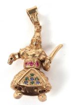 A 9ct samurai pendant, the figure in samurai armour with multi colour hardstones, arm raised holding