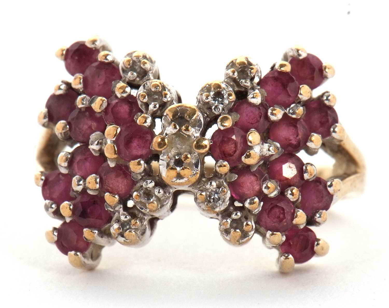 A 9ct ruby and diamond bow ring, the bow set with rubies and diamond detailing to centre, split - Image 2 of 6