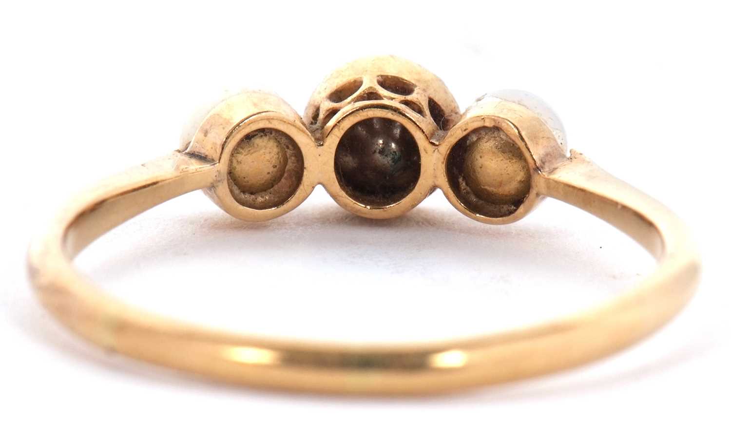 An 18ct three stone ring, set with a central white stone with a cultured pearl to either side, - Image 2 of 7