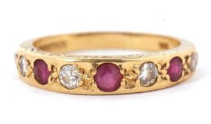 A 9ct ruby and diamond ring, set with graduated alternating rubies and diamonds, channel set with