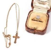 An 18ct and platinum ring and a 9ct cross necklace, the ring set with a square plaque with single