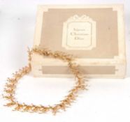 A Christian Dior jewellery box and a gilt necklace, the box labelled 'bijoux Christian Dior' with