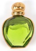 A Christian Dior brooch, the miniature perfume bottle shaped green glass brooch, with closed gilt