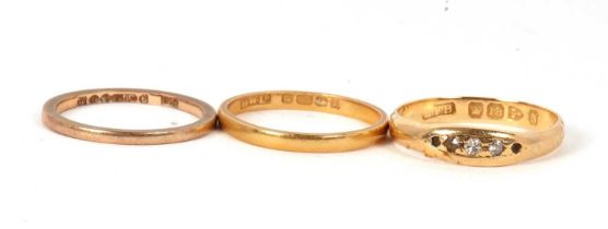Three gold rings: an 18ct diamond ring, Chester 1896, size O, 3.0g, (a/f); a 22ct wedding band,