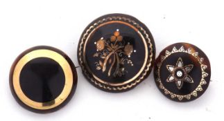 Three tortoiseshell pique work brooches, the largest with bi-colour inlaid floral decoration and