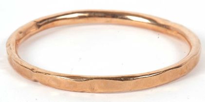 A 9ct gold bangle, the round hollow bangle approx. 6.5mm wide, stamped 9ct to side, approx 7cm