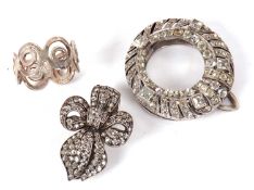 Three items of jewellery to include an early/mid 20th century round white paste set dress clip,