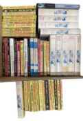 A collection of paperback and hardback novels including Westerns, Fu-Manchu etc