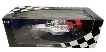 A boxed Minichamps 1:18 scale model racing car, 2000 US Grand Prix Inaugural Event Car