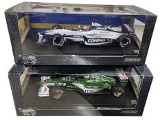 A pair of 1:18 scale boxed Hotwheels car models, to include: - Jensen Button, Williams F1 Team -