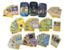 A collection of various 1999 Pokemon cards, together with three collectors tins and a 2022 Pikachu