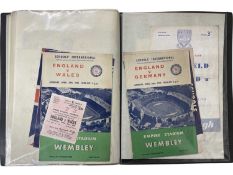 A folder containing football programmes and some ticket stubs for various 1960s England football