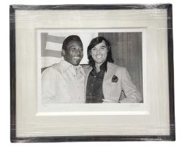 A limited edition numbered and signed giclée print - Pelé and George Best - with COA to rear. Signed