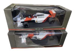 A pair of boxed Paul's Model Art 1:18 scale model racing cars, to include: - The Mclaren Collection,
