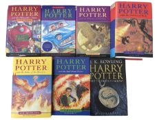 A set of hardbound Harry potter books, to include: - Philosopher's Stone: - Chamber of Secrets -