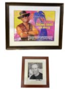 A mounted black and white photograph, bearing the signature of Paul Hogan (Crocodile Dundee) in