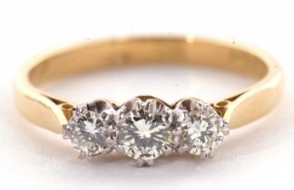 A three stone diamond ring, the three round brilliant cut diamonds, estimated approx. 0.42cts, all