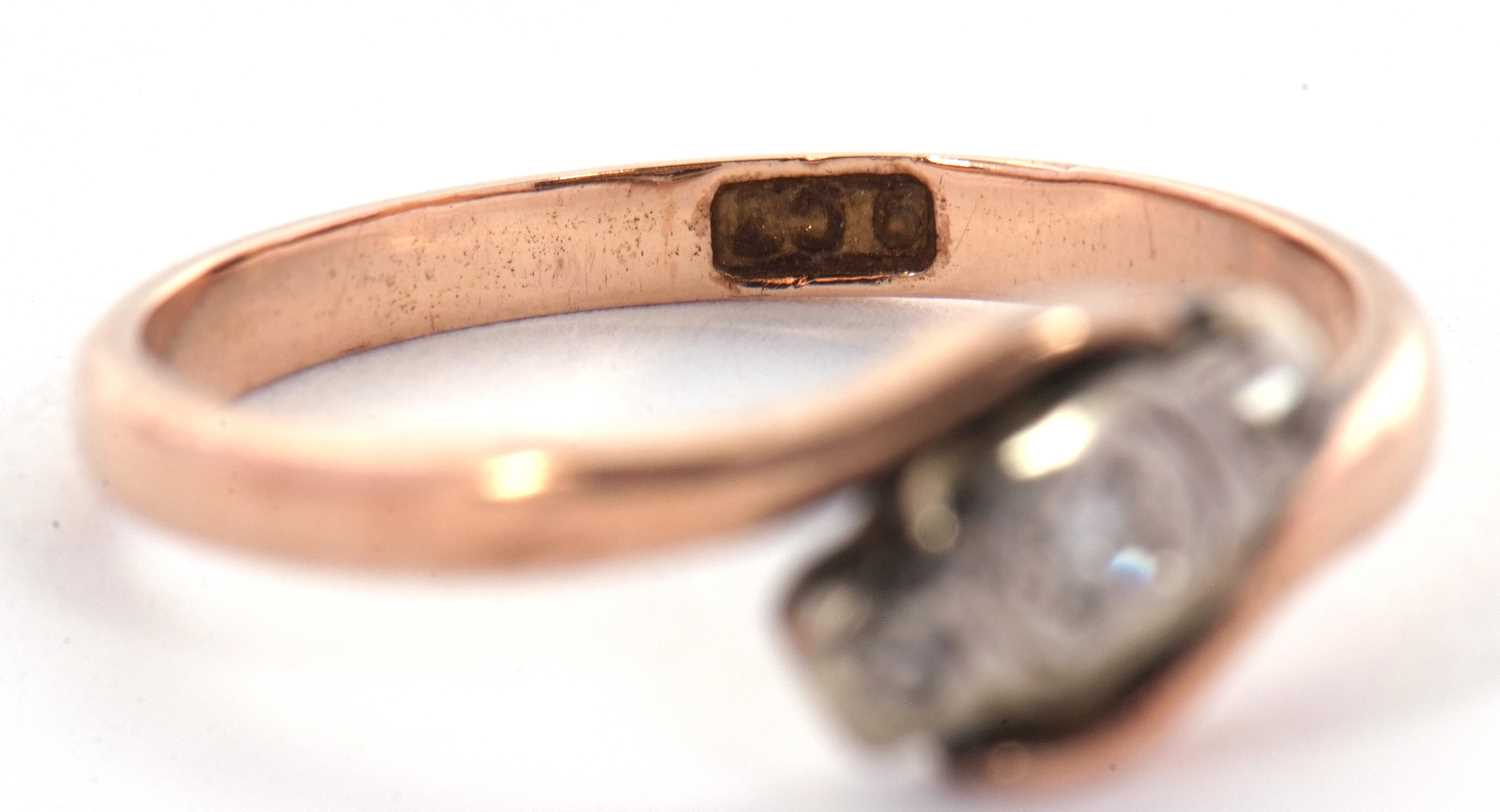 A 9ct diamond ring, the three small round diamonds, illusion mounted in a crossover band of rose - Image 5 of 7