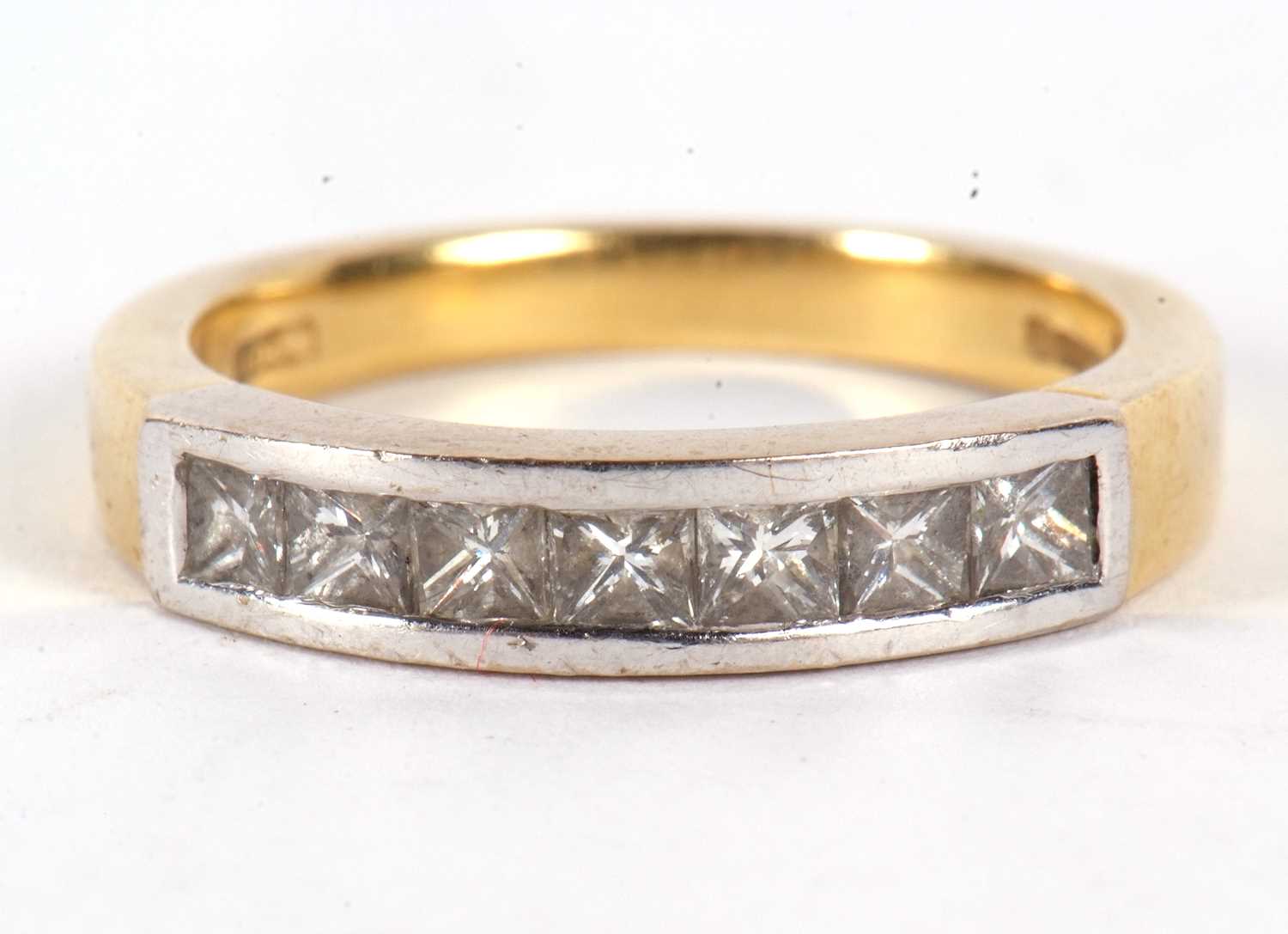 An 18ct diamond ring, with princess cut diamonds, total estimated approx. 0.70cts, channel set in - Image 3 of 7