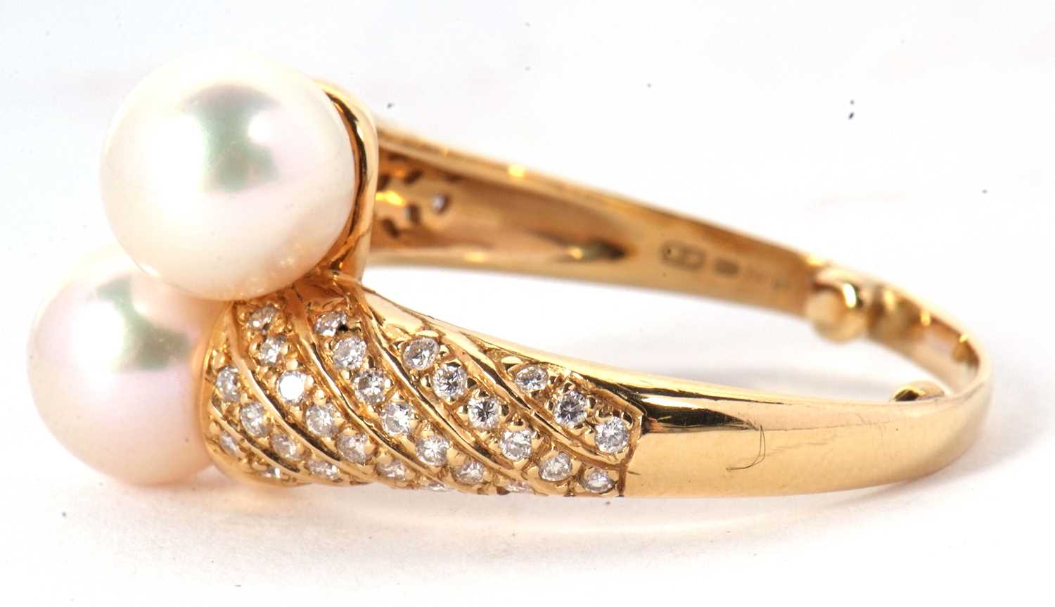 An 18ct cultured pearl and diamond crossover ring, the two cultured pearls set to a half set diamond - Image 6 of 8