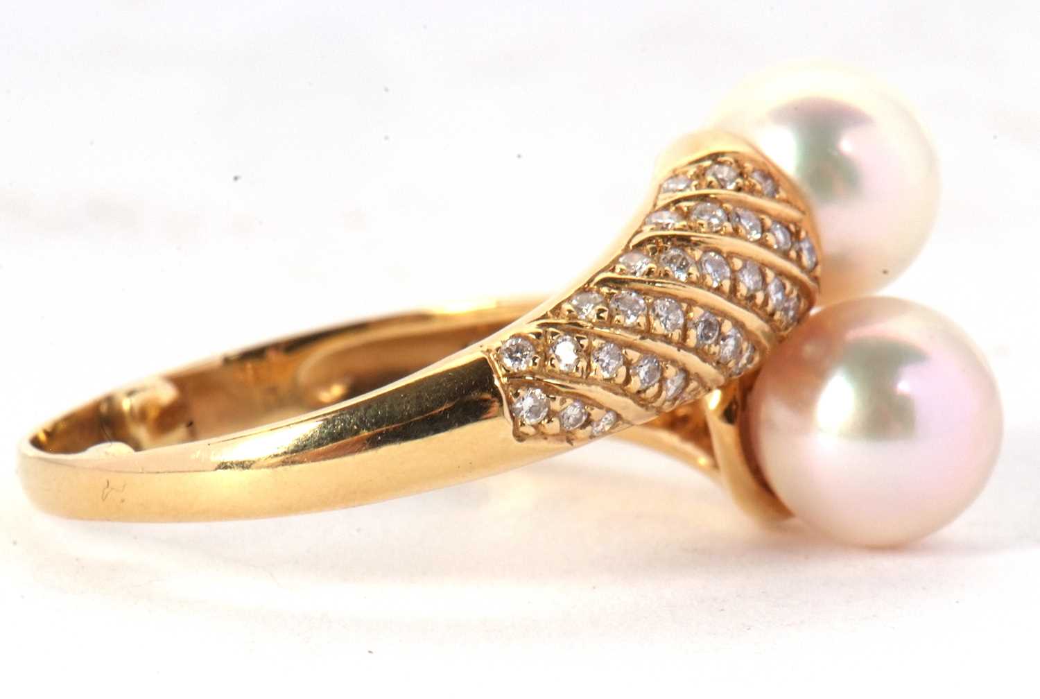 An 18ct cultured pearl and diamond crossover ring, the two cultured pearls set to a half set diamond - Image 8 of 8