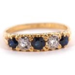 An 18ct sapphire and diamond ring, the three round sapphires interspaced with gypsy set round