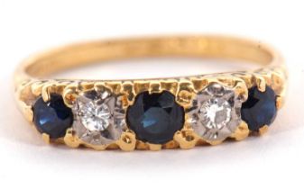 An 18ct sapphire and diamond ring, the three round sapphires interspaced with gypsy set round