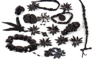 A quantity of jet and other jewellery to include three jet bracelets, a set of seven jet buttons,