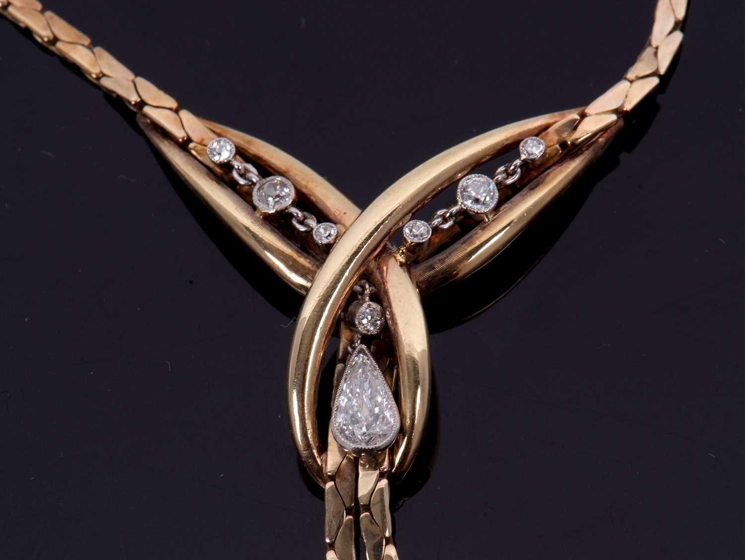 A 9ct diamond necklace, set to centre with crossover loop of gold set with a pear shape and a - Image 4 of 9