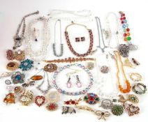 A quantity of costume jewellery to include glass crystal bead necklaces, brooches, diamante, etc