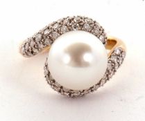 An 18ct cultured pearl and diamond ring, the central round cultured pearl, approx. 11.8mm