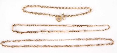 An unmarked yellow metal necklace, with T-bar style clasp and heart charm, jump ring only stamped