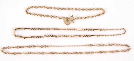 An unmarked yellow metal necklace, with T-bar style clasp and heart charm, jump ring only stamped
