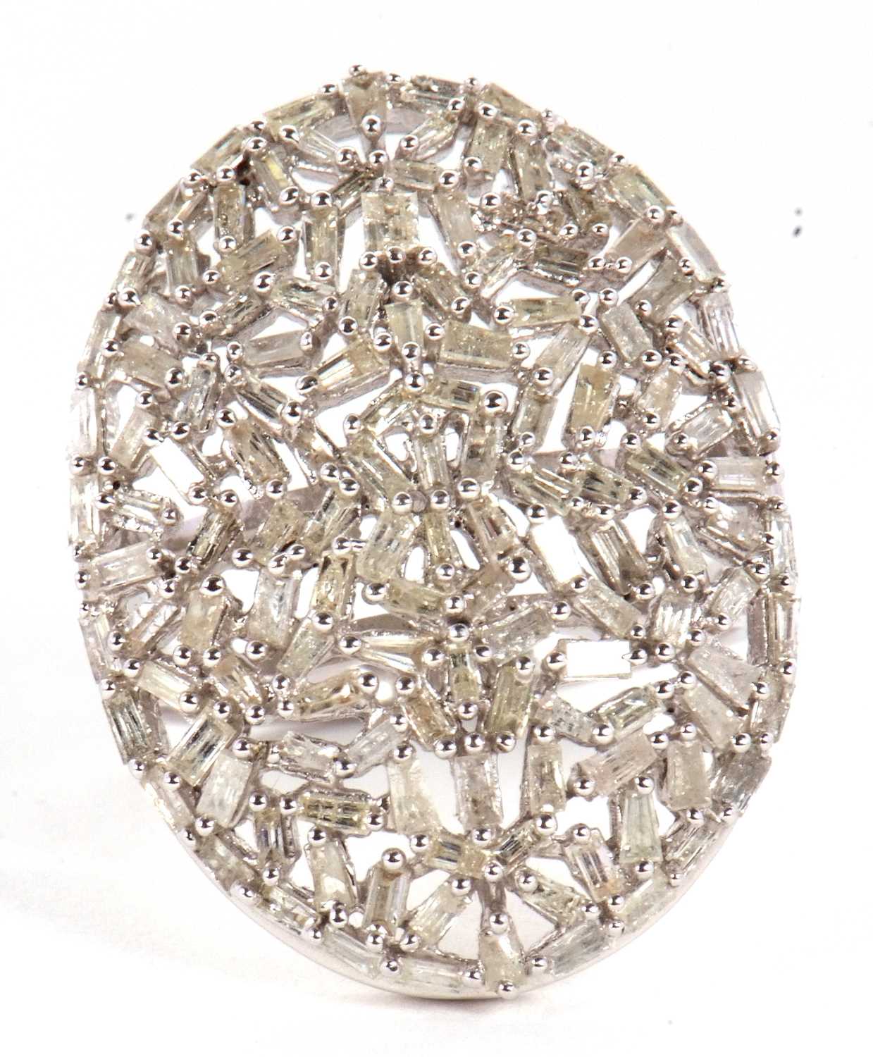A diamond plaque ring, the oval plaque set with a mix of tapered baguette cut diamonds, totalling - Image 2 of 7