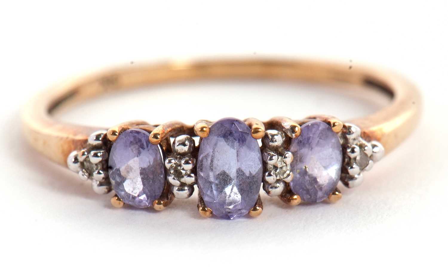A 9ct tanzanite and white stone ring, the three slightly graduated oval tanzanites interspaced - Image 5 of 5
