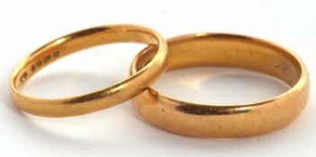 Two 22ct gold rings: one 4.5mm wide, hallmarked Birmingham 1910, size Q, 5.2g; the other 2.5mm wide,