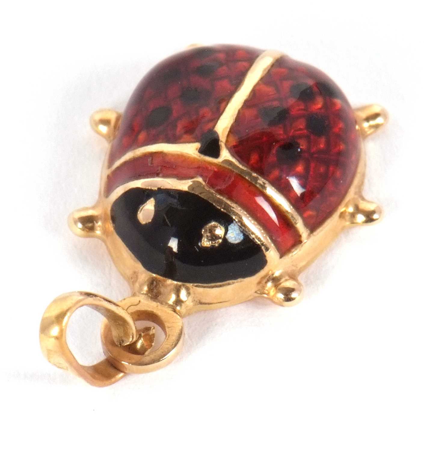 A ladybird pendant, the domed red and black enamelled body, with flat back of unmarked yellow - Image 2 of 3