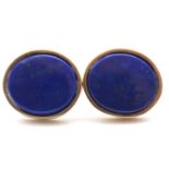 A pair of lapis lazuli earstuds, the oval discs of lapis lazuli in collet mounts and posts for