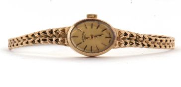 A lady's 9ct Rotary wristwatch, the signed oval dial with gilt baton numerals and hands, with