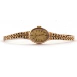 A lady's 9ct Rotary wristwatch, the signed oval dial with gilt baton numerals and hands, with