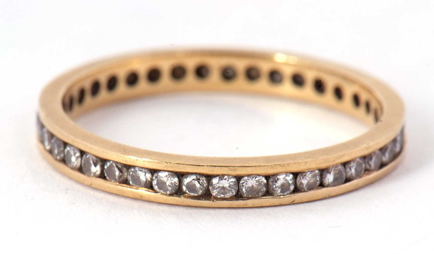 An 18ct eternity ring, with channel set small round diamonds, total estimated approx. 0.50cts, - Image 2 of 3