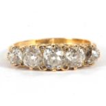 An 18ct five stone diamond ring, the five slightly graudated old mine cut diamonds, total