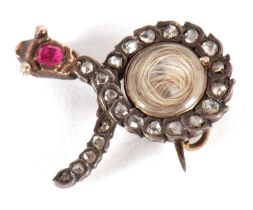 A diamond and ruby snake brooch, the snake set with rose cut diamonds and a single ruby to the head,