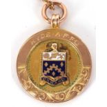 A 9ct 1929-30 Football medallion, the round medallion with enamelled coat of arms to one side and