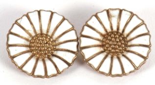 A pair of Danish silver gilt earrings by Anton Michelsen, the round white enamelled daisies with