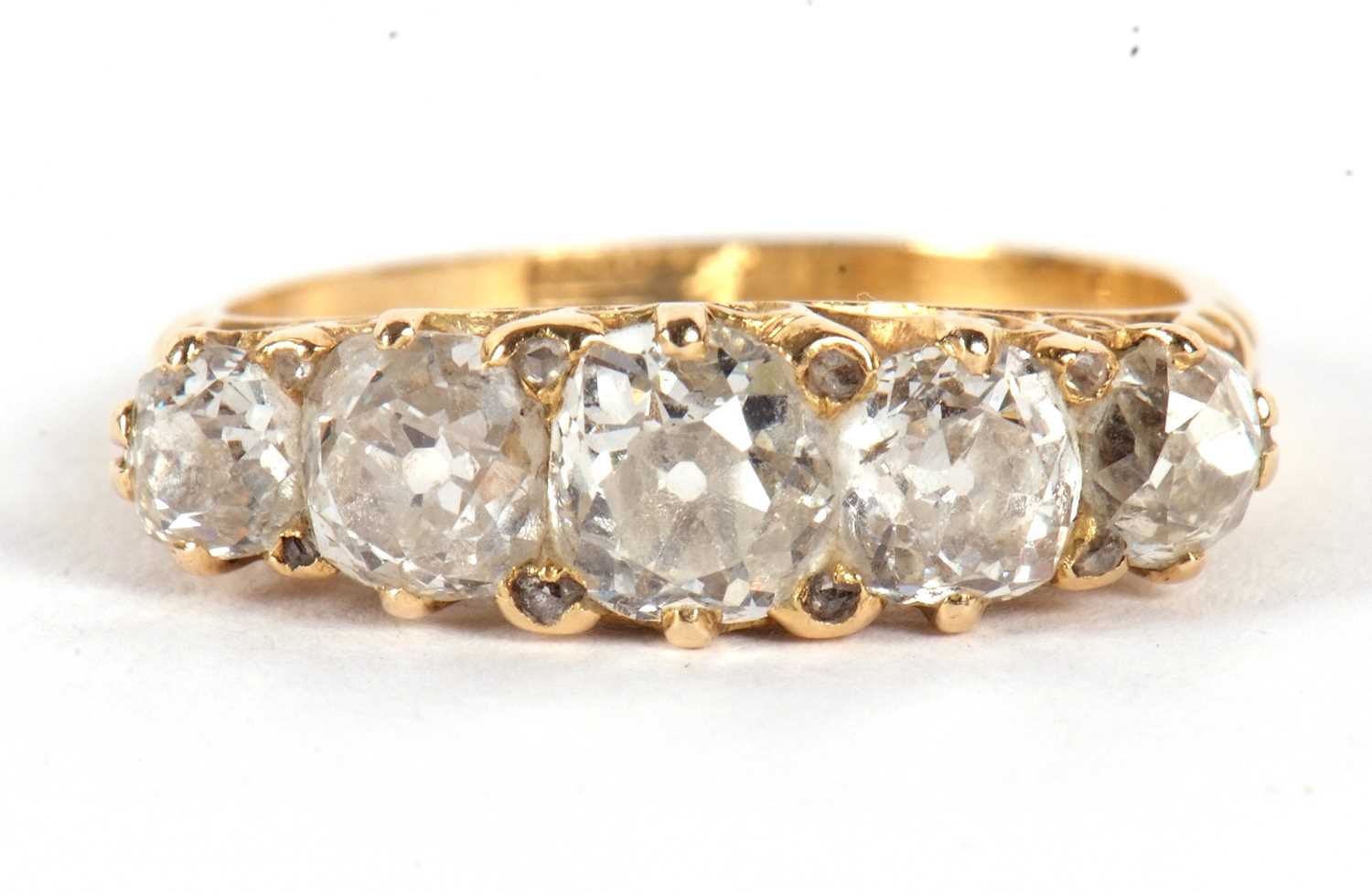 An 18ct five stone diamond ring, the five slightly graudated old mine cut diamonds, total - Image 6 of 8