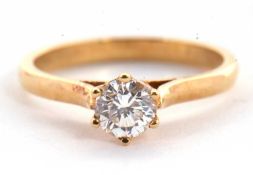 A diamond solitaire ring, the round brilliant cut diamond, stamped .50 to inner band, claw mounted