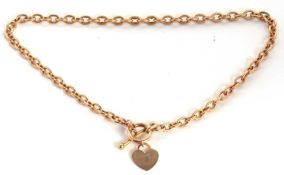 A belcher link necklace with heart shape charm, the necklace with integrated tag stamped 375, jump
